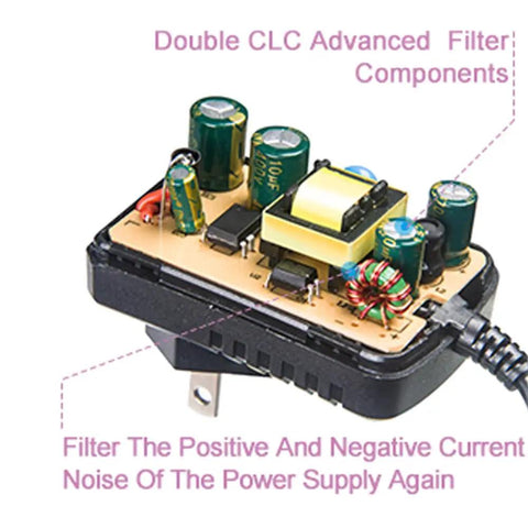 Internal view of 9V DC 1A Power Supply Adapter For Guitar Effects Pedals Center Negative Tip Universal AC Input 100 to 240V showing components.