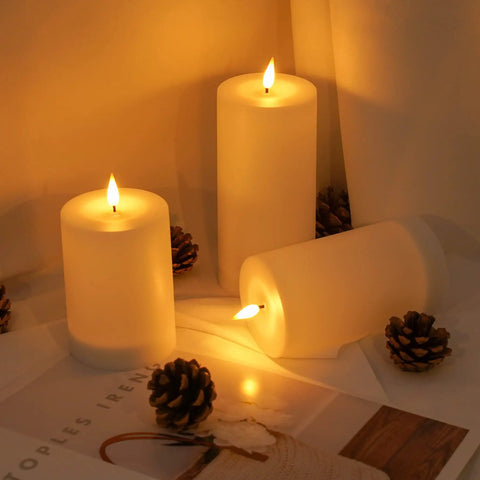 Solar Candles Outdoor Waterproof Flameless Pillar LED Lights Set Of 3 with flickering effect placed on a table
