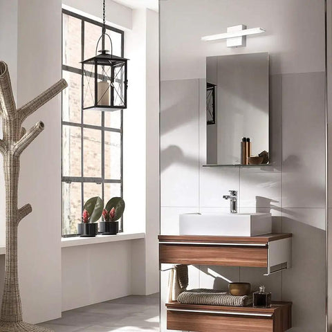 Lit Modern LED Vanity Light Bar For Bathroom, 16 Inch Chrome Mirror Light Fixture illuminating over bathroom sink
