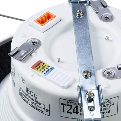 Close-up of color temperature selector on RL Series 5/6 Inch Recessed LED Retrofit Downlight with White Baffle Trim for Ceiling and Shower.