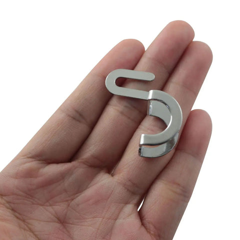 Hand holding Durable Metal Finger Guard For Sewing Machines Three Pack Silver Shield That Keeps Your Fingers Safe From Needle Jabs And Snags