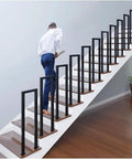 Floor Mounted U Shaped Stair Handrail Matte Black Heavy Duty Iron Railing Indoor Outdoor Steps in use on staircase.