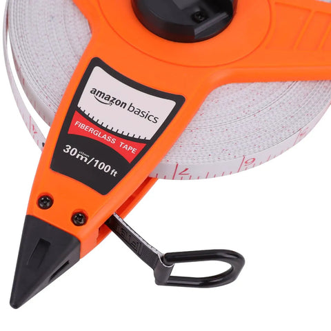 Open Reel Fiberglass Measuring Tape, Go-To Tool For Pros And DIYers, 100 Feet Of Non Stretch Vinyl Coated Tape displayed
