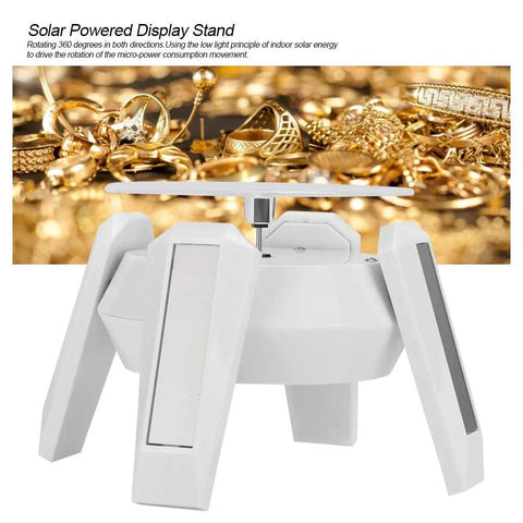 Solar Powered Jewelry Display Stand With 360 Degree Rotating Turntable And Blue LED Lights Electric Base positioned on a background of gold jewelry.