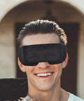 Smiling man wearing Badass Auto Darkening Welding Goggles Featuring Kickin Wraparound Coverage And Legit Precision Lenses.