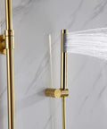 Wall Mounted Exposed Shower System Brushed Gold 3 in 1 with handheld sprayer and water flow, installed on marble wall.