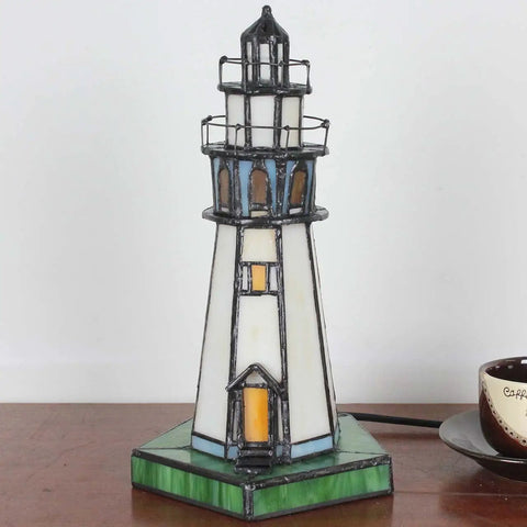 Lighthouse Style 10 Inch Tiffany Glass Table Lamp Handcrafted Stained Glass Accent Light For Home Decor LED Bulb Included Easy On Off Switch Lit Lighting For Living Room Or Nightstand shown on a wooden table.