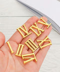 Quartz Clock Numerals Replacement Set Not Self Adhesive For Clock Repair And DIY Wall Clocks Arabic Numbers And Black Roman Numerals Available In Silver Gold Or Black Finish held in hand.