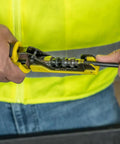 Installer using tool with Universal BNC Compression Coax Connector for RG6 and RG6 quad shield cables in dark nickel