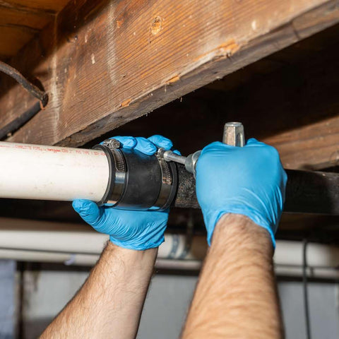 Flexible 2 Inch To 1.5 Inch Cast Iron Plastic And Steel Pipe Coupler Adapter For Sewer And Drain Connections Leak Proof Chemical Resistant Easy Fit For Copper PVC And Iron Piping Durable Construction installed on PVC and cast iron pipe