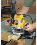 Beefy 2 1/4 Hp Plunge Router Kit With Sturdy Fixed Base And Electronic Variable Speed Control on workbench for precise routing.