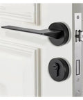 Split Lock Bedroom Door Handle Set In Matte Black, installed on a white door showing the privacy knob and handle detail
