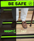 Person walking on stairs with heavy duty grip tape for stairs with glow in the dark strips waterproof anti slip non skid tape.