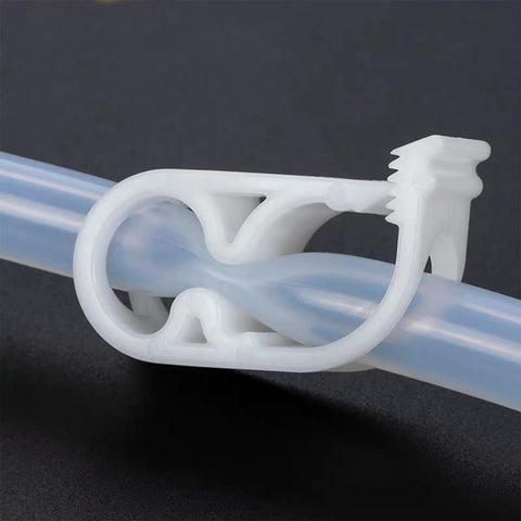 Close-up of 20Pcs Adjustable Plastic Tubing Clamps For Quarter To Half Inch Tubing in use on transparent hose