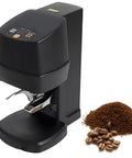 Automatic Coffee Tamper With Auto Position Sensor For Flawless Espresso Pucks Featuring Adjustable Pressure From 22 To 66 Pounds Plus Fast Depth Tweaks, black design with ground coffee.