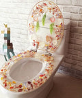 Universal Soft Close Toilet Seat Featuring A Chic Print Design And Heavy Duty Resin Construction For No Sweat Setup And Years Of Ultra Smooth Bathroom Comfort on a modern toilet.