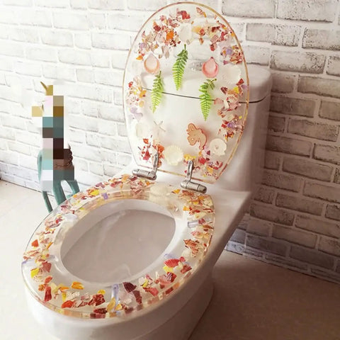 Universal Soft Close Toilet Seat Featuring A Chic Print Design And Heavy Duty Resin Construction For No Sweat Setup And Years Of Ultra Smooth Bathroom Comfort on a modern toilet.