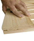 Close-up of Unfinished Interior Barn Door Slab DIY Kit With Solid Pine Core, showing edge detail and knotty pine grain.