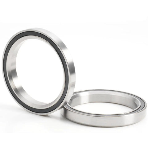 Ride Smooth With This Bike Headset Bearing Set 40 X 52 X 7 Mm Sealed Grease Packed 45/45 Degree Balls For 1-1/2 Inch Headset Repair Parts Pack Of 2 Durable, showing two metal bearings with black seals on a white background.