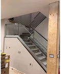 Premium Aluminum Base Rail Channel For Deck And Stairway Railing with clear glass on staircase, enhancing stability and design.