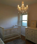 Plug-In Five Light Crystal Chandelier Swag Hanging Fixture With White Metal Frame And Clear Glass Stems And Acrylic Crystals in nursery