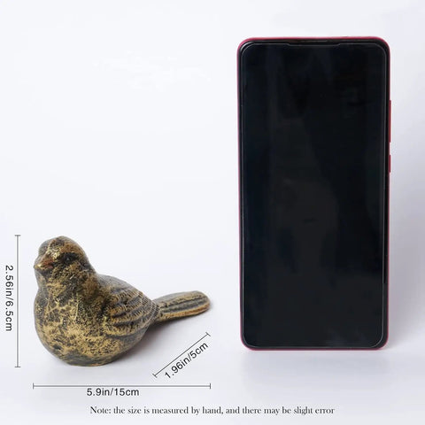 Cast Iron Bird Door Stopper Set 2 Heavy Duty No Drill Floor Door Stops with Handle Antique Bronze Finish next to smartphone