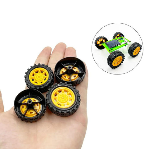 Hand holding 20Pcs 34mm Toy Car Wheels with 10Pcs 2mm Shafts and 100mm Axles for RC Cars and DIY Robots.
