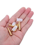 Brass Shelf Pins With No Slip Rubber Covers For Cabinets And Bookshelves One Quarter Inch in a hand