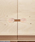 Tapered Wood Plugs For Screw Holes With Button Plug Head on plywood surface for home improvement and DIY woodworking projects.
