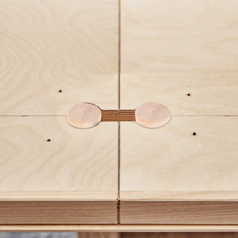 Tapered Wood Plugs For Screw Holes With Button Plug Head on plywood surface for home improvement and DIY woodworking projects.