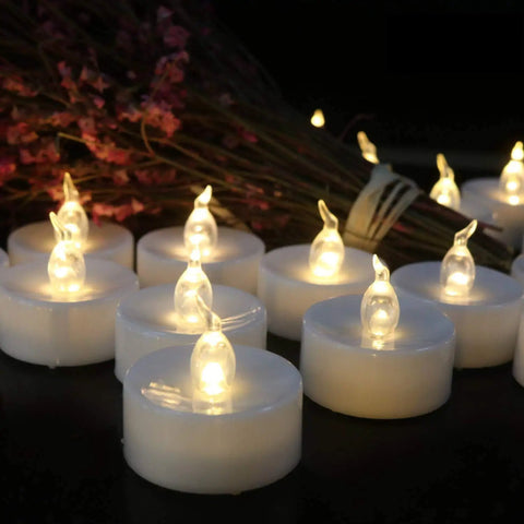 Battery Operated LED Tea Light Candles 24 Pack Flameless Flickering Warm White for Seasonal Decor displayed with flowers