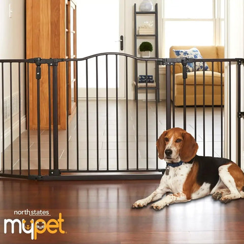 Extra Wide Windsor Arch Walk-Through Pet Gate 38.3 To 72 Inches Wide, 30 Inches Tall, Hardware Mounted, in living room setting.