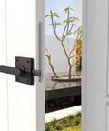 Rugged Matte Black Gate Latch With Double Sided Self-Locking Aluminum Gate Hardware for outdoor gates installed on white door