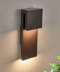 Image of a bronze finish Sleek Outdoor Indoor LED Wall Sconce With Two Lights, 17W Total, mounted on a wall.