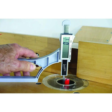 Straight Shooter Magnetic Height Gauge For Woodworking Jointer Router And Planar Blades measuring depth with digital display in workshop.