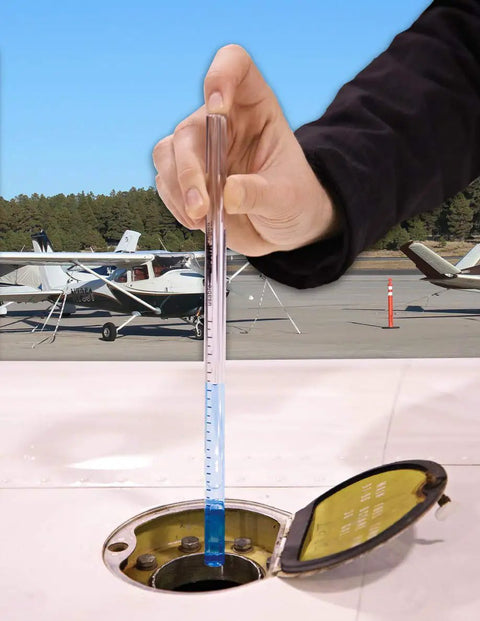 Hand using Fuelhawk Aircraft Fuel Gauge for Cessna 182 with 43.5 gallon usable per tank calibrated readout, clear tube.