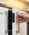Eight Piece Ultra Thin Magnetic Cabinet Door Catch No Drill Stainless Steel With Strong Hold Quiet Operation shown installed on cabinet.