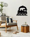 Black locomotive train metal wall art in living room decor, 20 inch vintage style, wall-mounted near modern chair and table