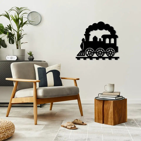 Black locomotive train metal wall art in living room decor, 20 inch vintage style, wall-mounted near modern chair and table