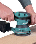 5 Inch Random Orbit Sander With 3 Amp Motor And Variable Speed Dial 4,000 To 12,000 OPM used on wood surface