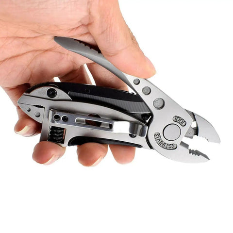 Hand holding Two Piece Portable Stainless Steel Multitool Pliers Set With Wire Cutters And Multi Purpose Wrench for Outdoor Survival