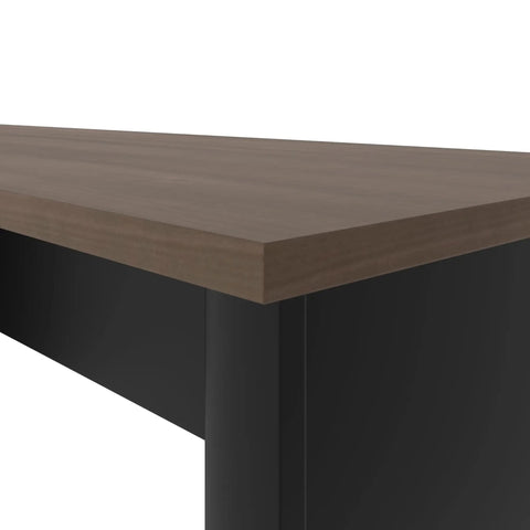 Close-up view of the laminate top of the Badass L Shaped Standing Desk With Three Drawer Pedestal, one inch thick.