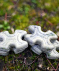 Camouflage Bow Vibration Dampeners For Unisex Adults Cuts Noise By Up To 70 Percent With NAVCOM Material on forest ground