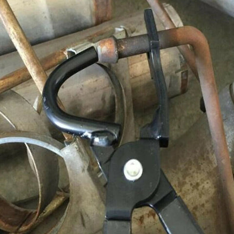 Amazon exhaust hanger removal pliers; black metal tool gripping a rubber exhaust hanger around a rusted exhaust pipe