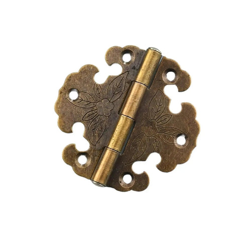 Antique bronze hinge from the Two Pack Antique Iron Sheet Hinges With Soft-Close Damping, decorative floral design, top view.