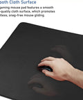 Hand using mouse on Ultra Large Extended Gaming Mouse Pad With Stitched Edges And Non Slip Natural Rubber Base For Esports Pros And Everyday Desk Setup, Waterproof Keyboard Mat Measuring 31.5 By 15.7 Inches, Pro Grade, Ideal For Gaming And Office.