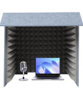 Rock Solid Desktop Soundproof Vocal Recording Booth Cube Featuring Heavy Duty Acoustic Foam Panels For Podcast Mic Isolation and Zero Noise Interference Hassle Free Home Studio Gear For Slick Vocal Takes And Streamer Ready Audio Vibes with laptop and microphone inside.