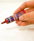 Tough As Nails Medium Strength Threadlocker Glue Secures Nuts Bolts And Fasteners Against Shake Out Vibrations Rusty Threads Removable Formula 12 Pack Of 6 Ml Tubes, held in hand, showing applicator tip.