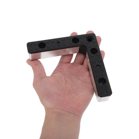 Close-up of L-shaped aluminum furniture leg with black plastic top held in hand, part of a Four Pack L Shaped Aluminum Furniture Legs With Plastic And Alloy Replacement Sofa And Cabinet Feet With M5 Screws Leveling Support To Prevent Accidental Bumps And Floor Scratches set