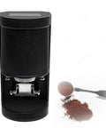 Top Shelf Commercial 58mm Electric Coffee Tamper Featuring Hella Precise 1200N Sensor Operated Tamping Force With Touchscreen Pressure Adjustment And Rock Solid Adjustable Stand For Busy Cafe Bars, black design with touchscreen.